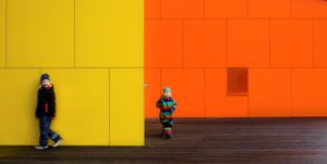 Steni yellow and orange facade with children